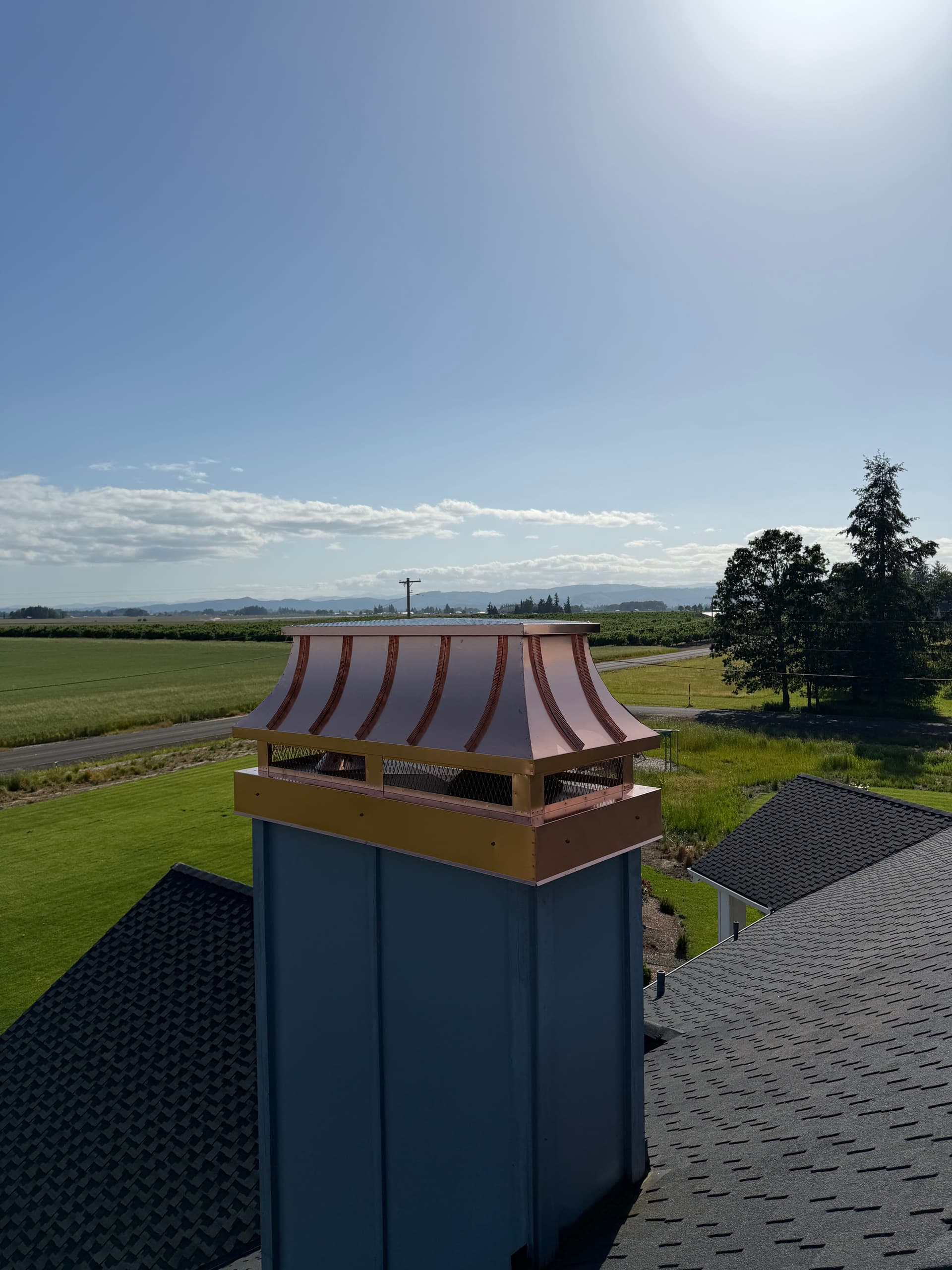 Custom 16oz Copper Concave Chimney Cap Installed in Hillsboro Oregon image